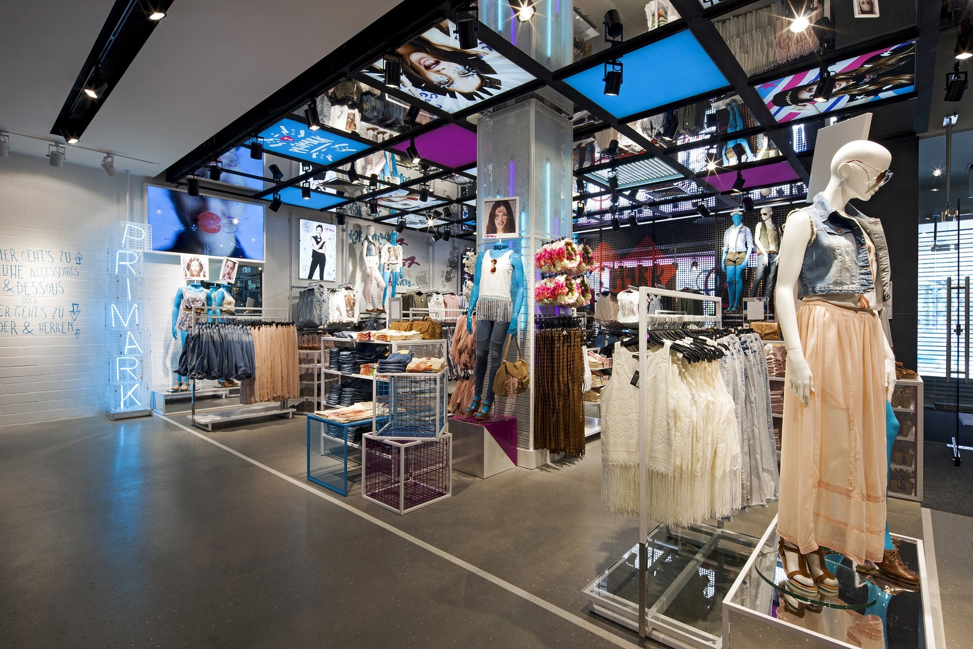 Primark women's clothing store with bright white and florescent lighting