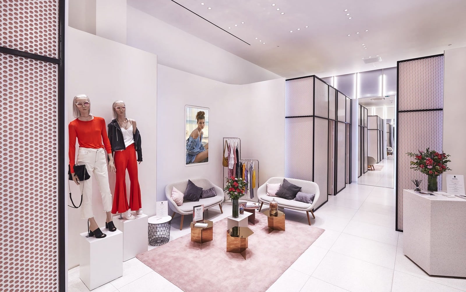 Topshop dressing room with seating area and mannequins - neutral lighting and interior